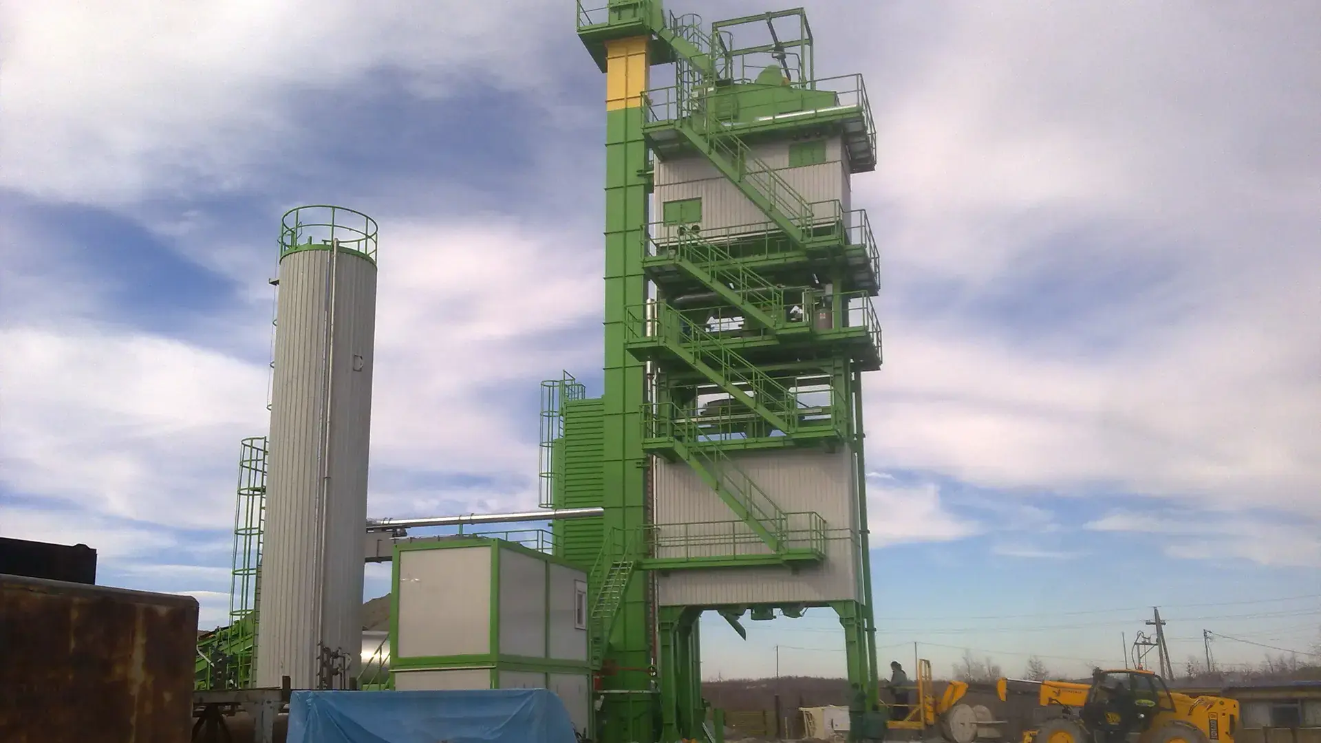 An asphalt plant with silos and conveyors